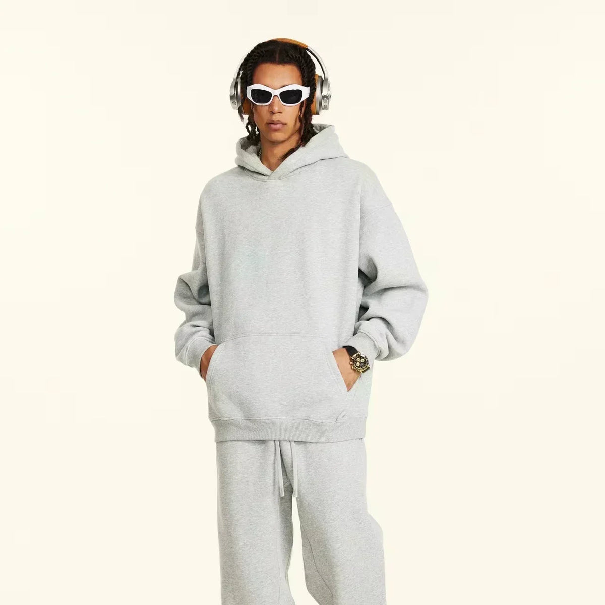 A men's casual hooded sweater with blessing cross design and geometric patterns in a regular fit suitable for spring and autumn